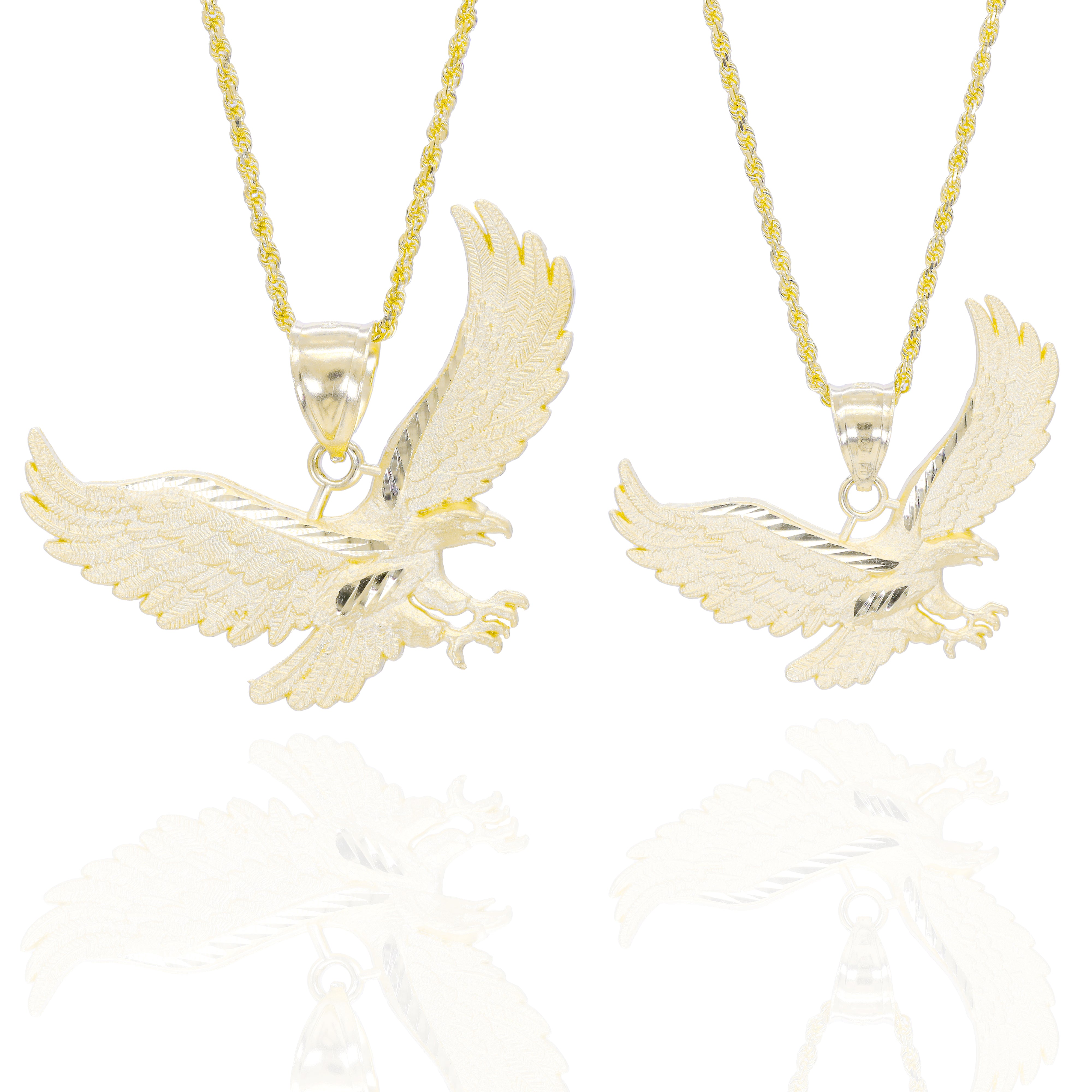 Two gold eagle pendants in different sizes on gold chains 
