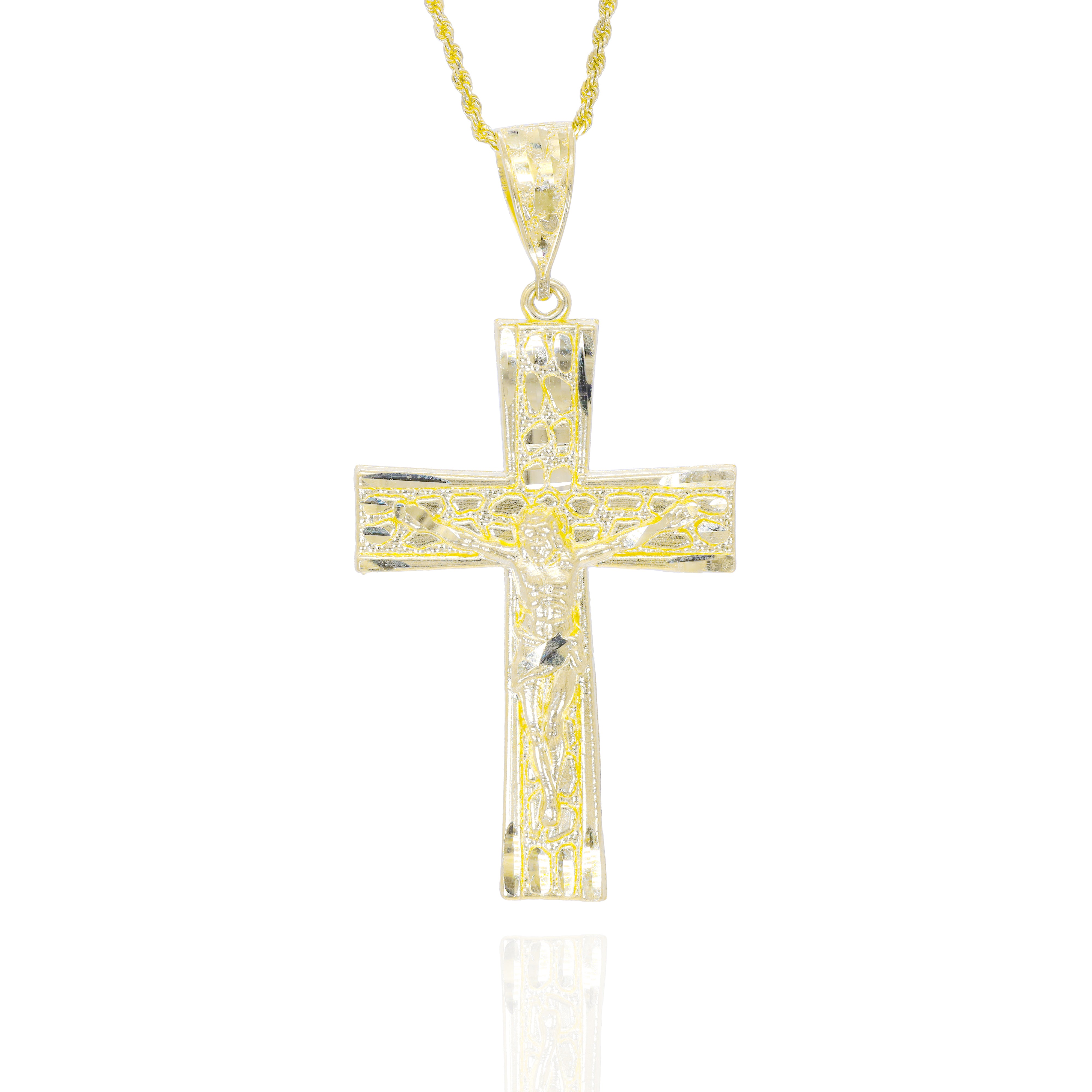 Gold cross pendant with nugget design and Jesus on top